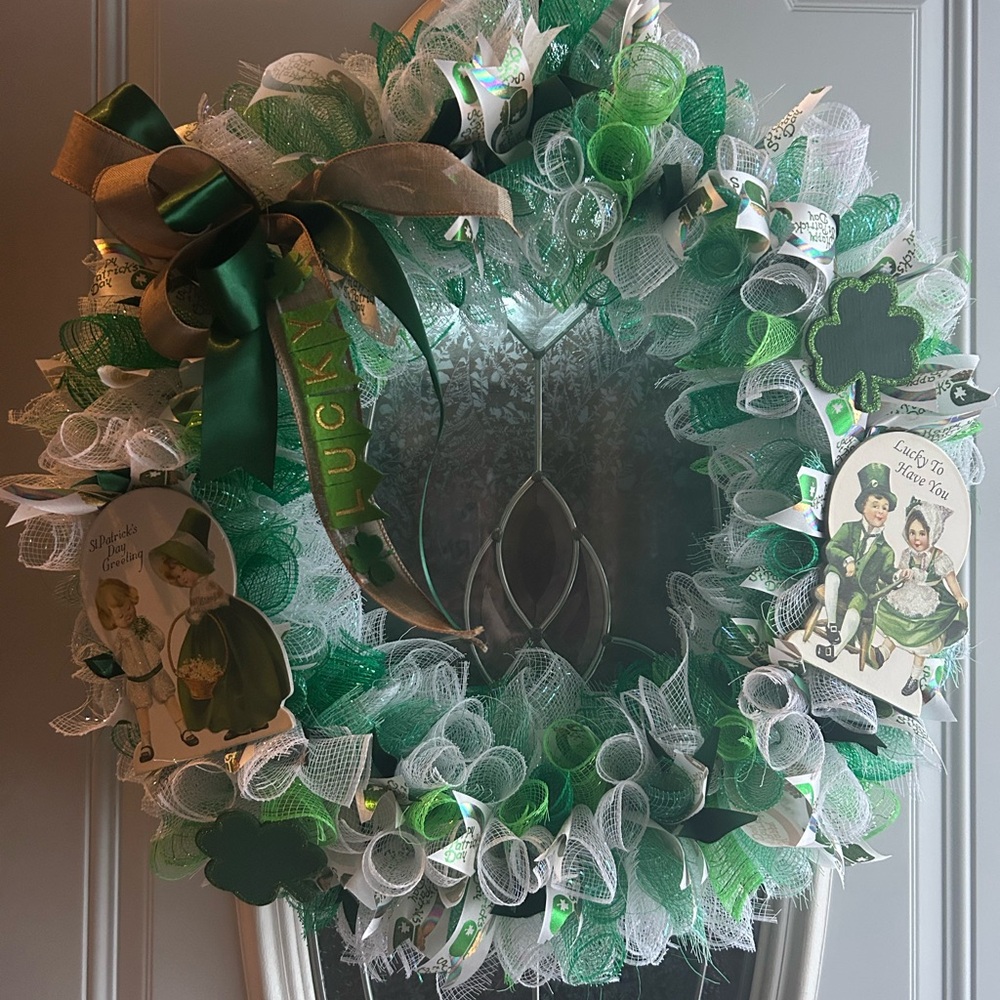 Festive Green and White Wreath with Ribbon Accents